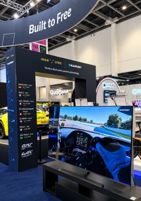 Iron Lynx and Blaupunkt arch with a sim-racing setup on a Blaupunkt TV, IFA 2026